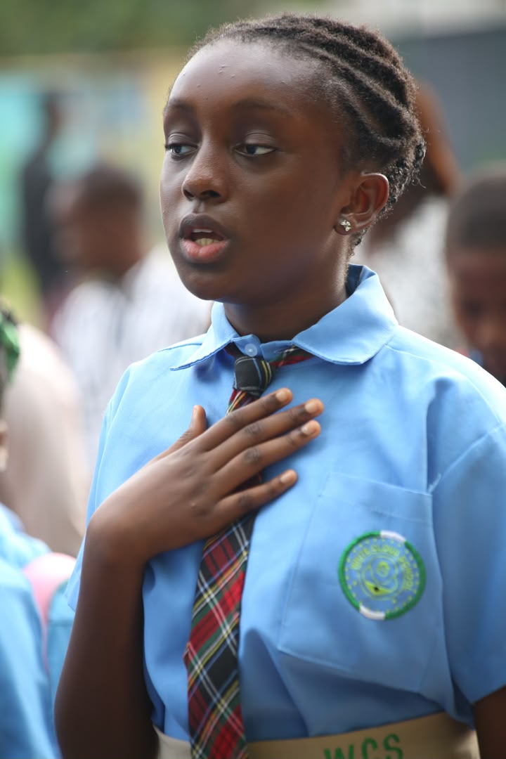 Student wearing the WCS sash reciting the pledge