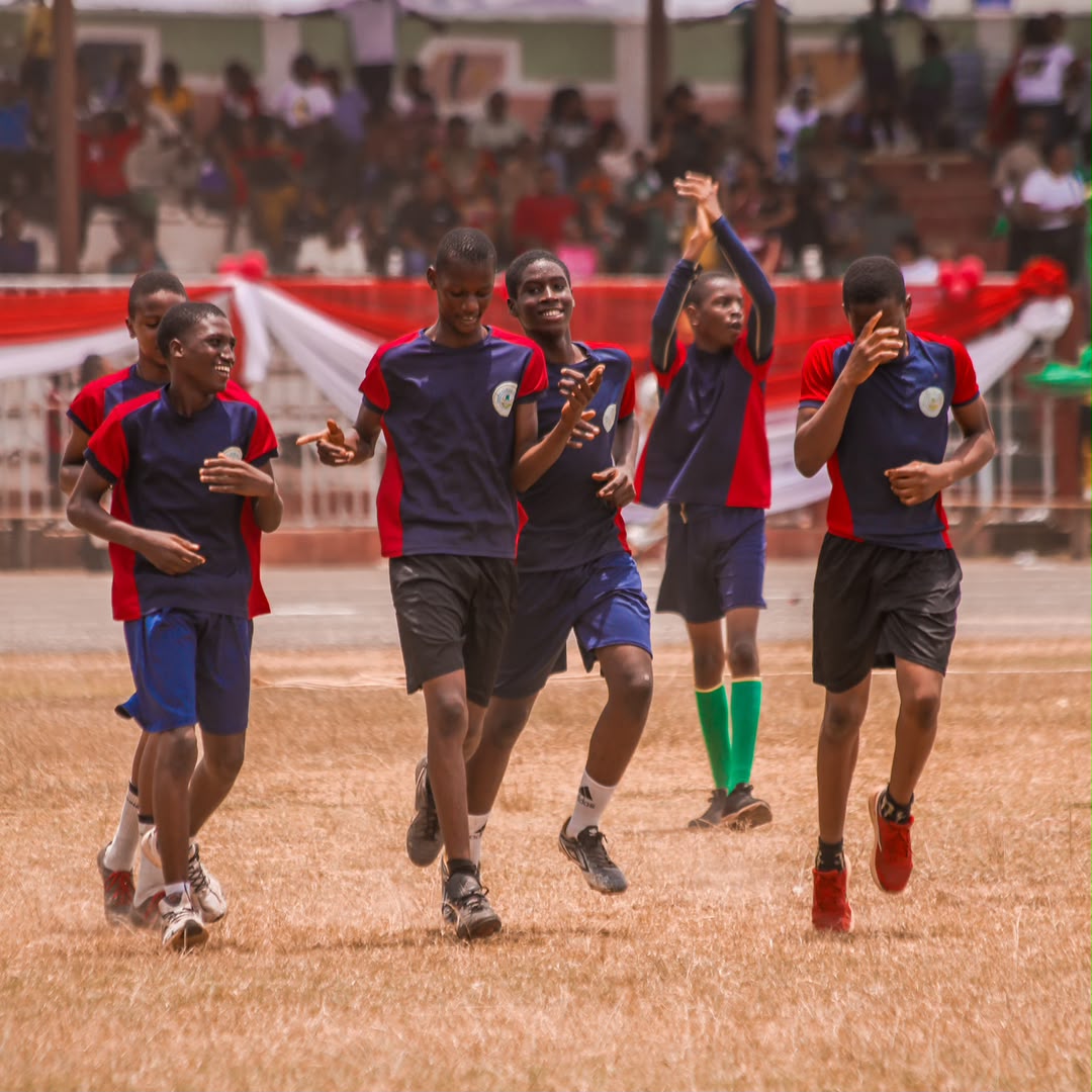 Team jogging and clapping to the crowd