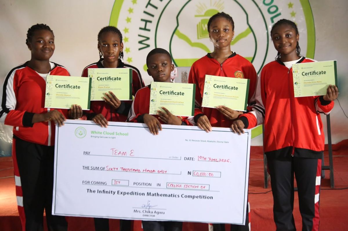 Team E with the winners' cheque