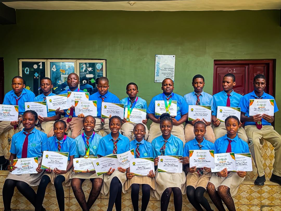 College students holding their National Mathematics Festival certificates